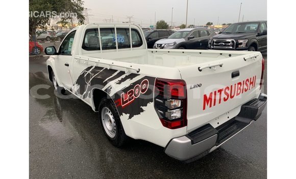 Buy Import Mitsubishi L200 White Car in Import - Dubai in Great Comore Buy Import Mitsubishi L200 White Car in Import - Dubai in Great Comore
