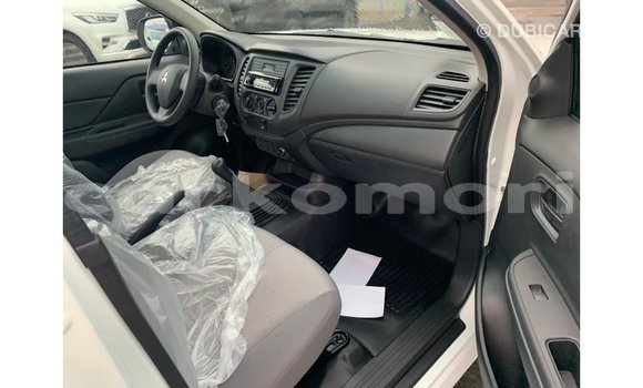 Buy Import Mitsubishi L200 White Car in Import - Dubai in Great Comore Buy Import Mitsubishi L200 White Car in Import - Dubai in Great Comore