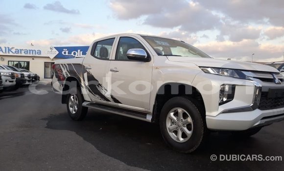 Buy Import Mitsubishi L200 White Car in Import - Dubai in Great Comore Buy Import Mitsubishi L200 White Car in Import - Dubai in Great Comore