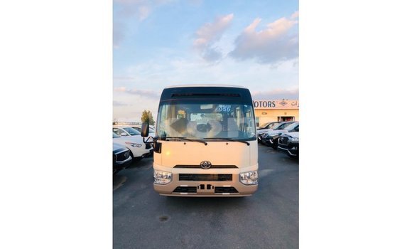 Acheter Import Voiture Toyota Coaster Blanc à Import - Dubai, Grande Comore